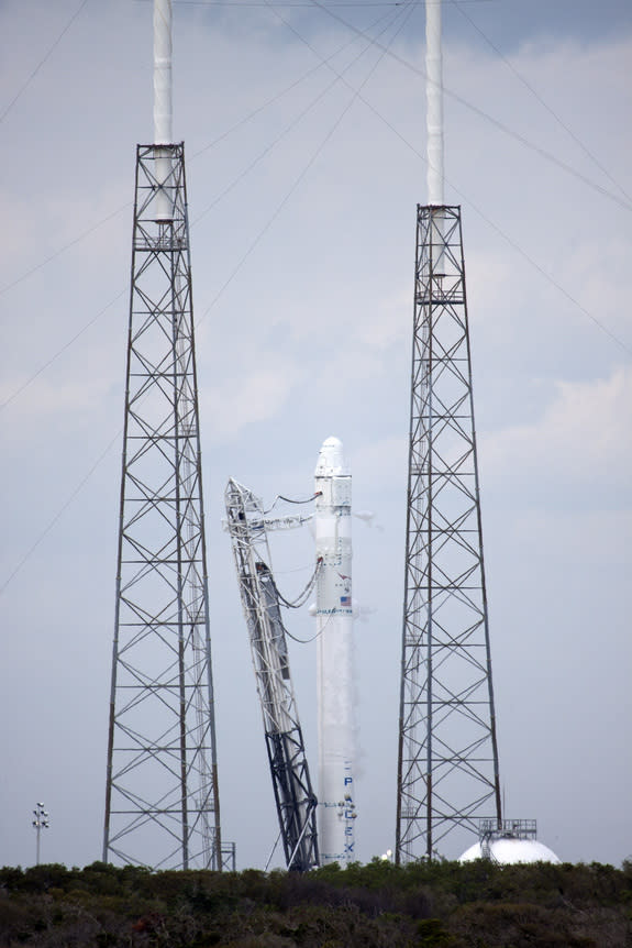 The SpaceX Falcon 9 rocket remains standing on Launch Complex 40 at Cape Canaveral Air Force Station in Florida following a test firing of the vehicle's nine Merlin first-stage engines. Image released Feb. 25, 2013.
