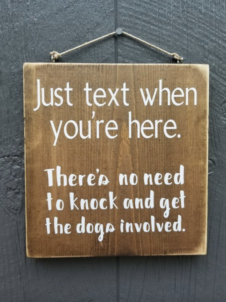 door sign says to text upon arrival