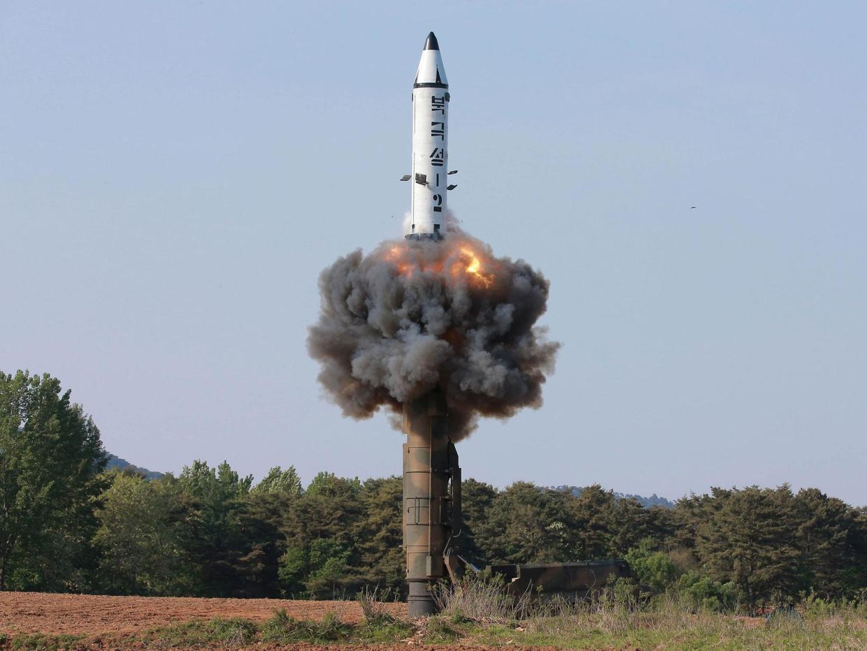 North Korea test fires medium-range ballistic missile Pukguksong-2, which flew about 500km (310 miles) and reached a height of 560km (350 miles) before plunging into the Pacific Ocean: Reuters