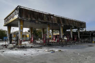 This photo released by the Iranian Students' News Agency, ISNA, shows a gas station that was burned during protests that followed authorities' decision to raise gasoline prices, in Tehran, Iran, Sunday, Nov. 17, 2019. Ayatollah Ali Khamenei, Iran's supreme leader on Sunday backed the government's decision to raise gasoline prices and called angry protesters who have been setting fire to public property over the hike "thugs," signaling a potential crackdown on the demonstrations. (Abdolvahed Mirzazadeh/ISNA via AP)