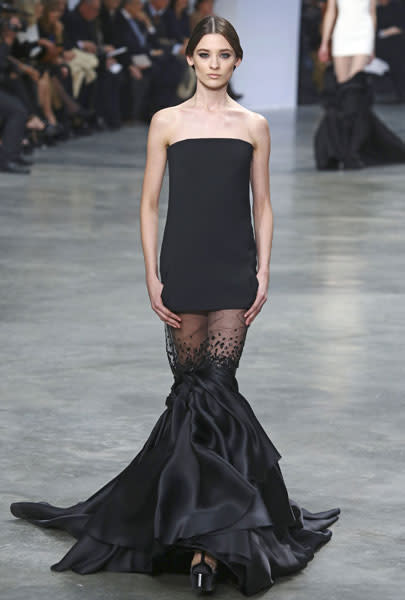 <b>Stephane Rolland SS13 </b><br><br>Gowns at the Stephane Rolland show featured a sheer bottom half with fishtail past the knee.<br><br>© Rex
