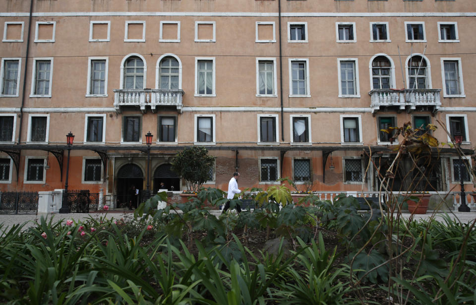 A waiter walks at the newly restored Royal Gardens in Venice, Italy, Tuesday, Dec. 17, 2019. Venice’s Royal Gardens were first envisioned by Napolean, flourished under Austrian Empress Sisi and were finally opened to the public by the Court of Savoy, until falling into disrepair in recent years. After an extensive restoration, the gardens reopened Tuesday as a symbol both of the lagoon city’s endurance and the necessity of public-private partnerships to care for Italy’s extensive cultural heritage. (AP Photo/Antonio Calanni)