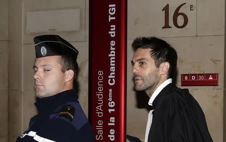 Pierre Darkanian (R), lawyer of Flavien Moreau, a 27-year-old described in court documents as a determined Islamist militant, leaves a Paris court November 13, 2014. REUTERS/Jacky Naegelen