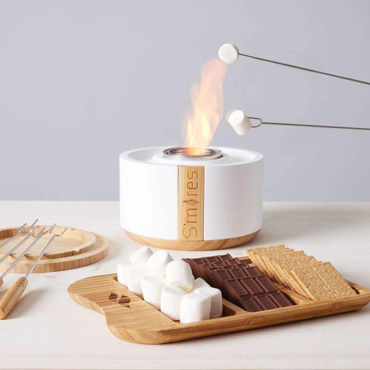 <p><a href="https://www.crateandbarrel.com/terraflame-smores-deluxe-white-tabletop-fire-bowl/s221083" rel="nofollow noopener" target="_blank" data-ylk="slk:Shop Now;elm:context_link;itc:0;sec:content-canvas" class="link rapid-noclick-resp">Shop Now</a></p><p>Deluxe S’mores Gift Bundle</p><p>crateandbarrel.com</p><p>$99.95</p><span class="copyright">Micki Wagner</span>