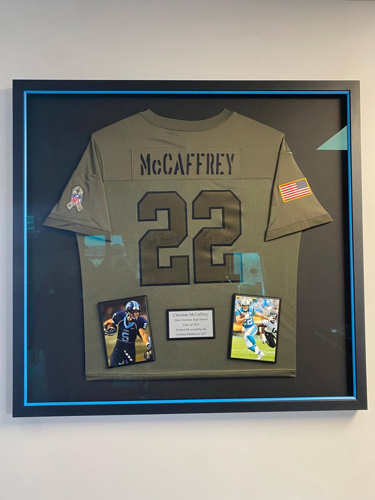 A signed Christian McCaffrey jersey hangs in the press box at Valor Christian High School. The All-Pro running back played football at the school and will play in Super Bowl 58 as a member of the San Francisco 49ers.