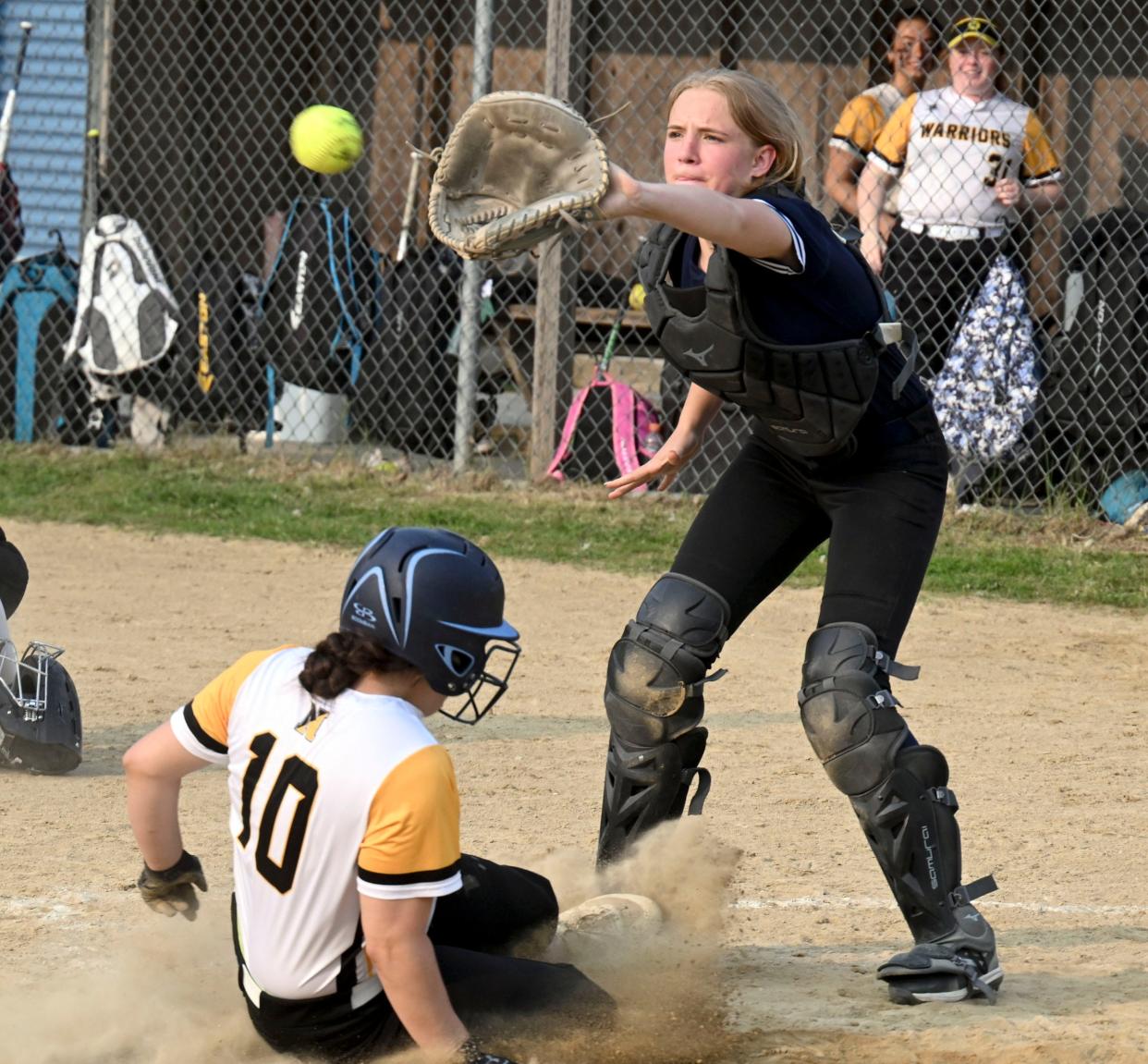 Jillian Parrott of Nauset arrives safely at home ahead of the throw to Sturgis catcher Ryley Mayo of Sturgis.