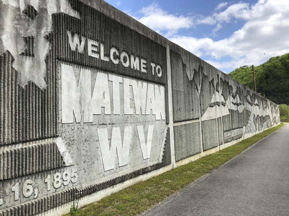 In this Tuesday, May 12, 2020, photo is a floodwall protecting the town of Matewan, W.Va, from the Tug Fork of the Big Sandy River. (AP Photo/John Raby)