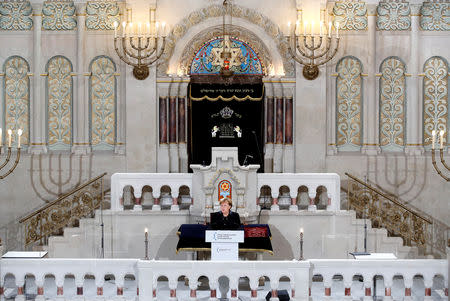 German Chancellor Angela Merkel speaks during a ceremony to mark the 80th anniversary of Kristallnacht, also known as Night of Broken Glass, at Rykestrasse Synagogue, in Berlin, Germany, November 9, 2018. REUTERS/Axel Schmidt