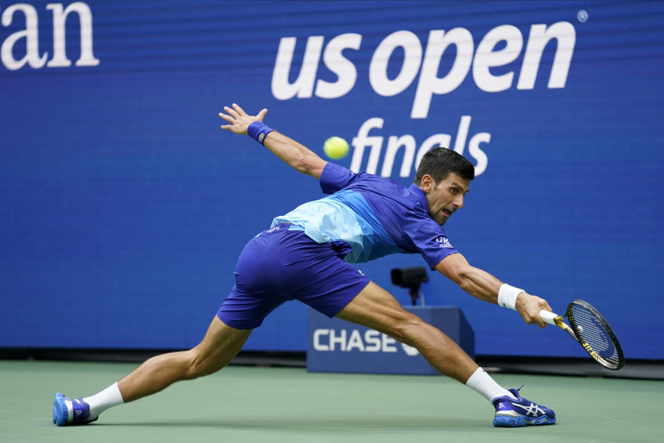 Novak Djokovic, of Serbia, returns a shot to Daniil Medvedev, of Russia, during the men's singles final of the US Open tennis championships, Sunday, Sept. 12, 2021, in New York. (AP Photo/John Minchillo)