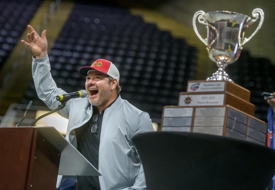 Peoria Rivermen head coach Jean-Guy Trudel celebrates his team's SPHL championship with fans during a ceremony Friday, May 6, 2022 at the Peoria Civic Center.