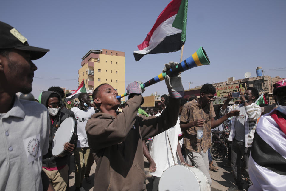 People take part in a protest against the October military takeover and a subsequent deal that reinstated Prime Minister Abdalla Hamdok but sidelined the movement in Khartoum, Sudan, Sunday, Dec. 19, 2021. (AP Photo/Marwan Ali)