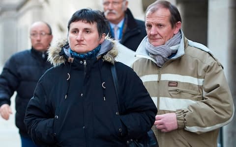 Parents of murdered French au-pair Sophie Lionnet, Catherine Devallonne (L) and Patrick Lionnet (R) leave the Old Bailey, - Credit: NIKLAS HALLE'N /AFP