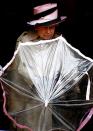 <p>The Queen folds her umbrella, allowing photographers to capture just how well its brim matched her hat.<br></p>