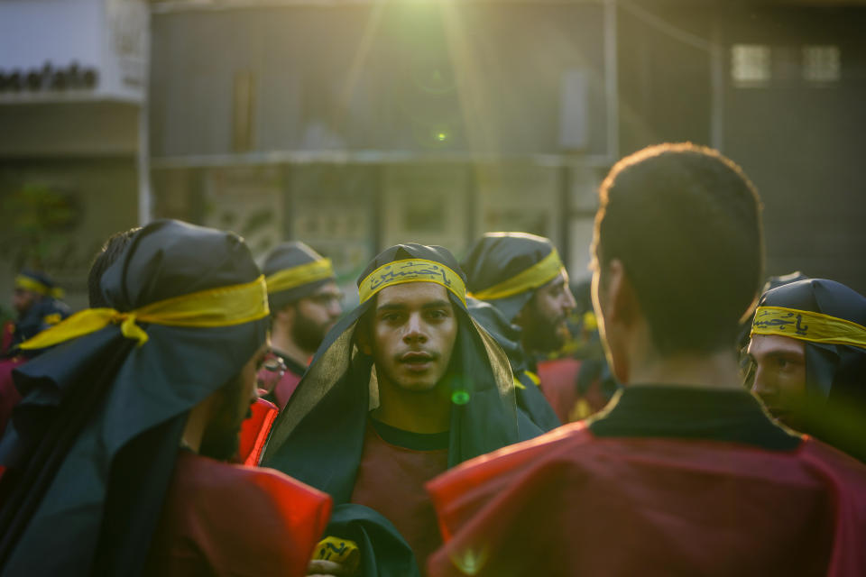 Hezbollah supporters in a sermon listen to the story of Ashoura, the Shiite Muslim commemoration marking the death of Imam Hussein, the grandson of the Prophet Muhammad, at the Battle of Karbala in present-day Iraq in the 7th century, in the southern suburbs of Beirut, Lebanon, Saturday, July 29, 2023. The leader of Lebanon's Hezbollah militant group said Saturday that if the governments of Muslim-majority nations do not take action against countries that allow the desecration of the Quran, it is the responsibility of Muslims to "punish" those who facilitate attacks on the Islamic holy book. (AP Photo/Hassan Ammar)