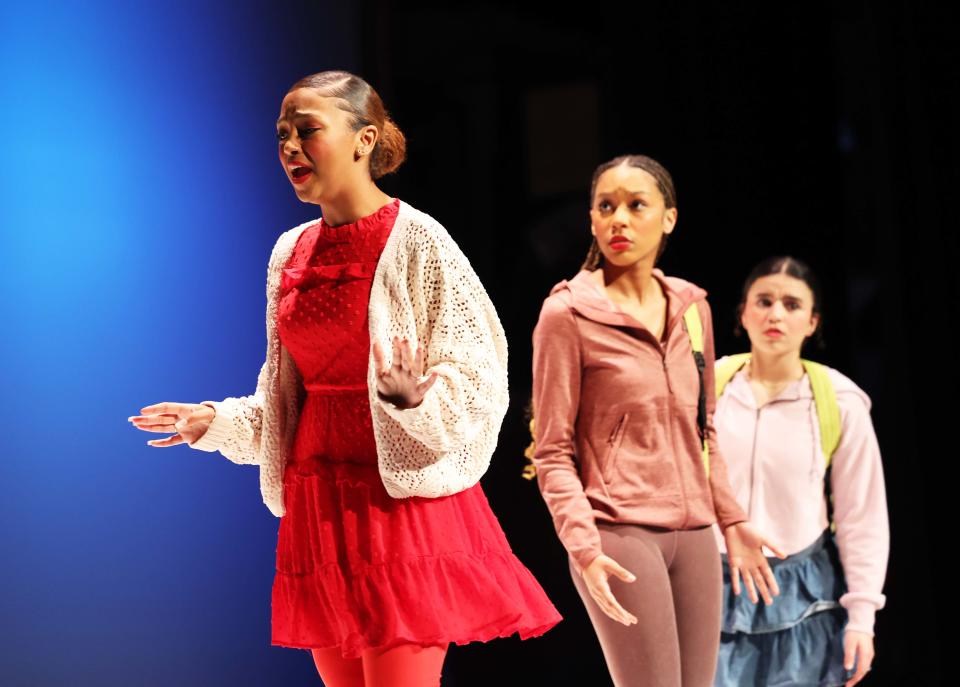 From left, Yanisa Andrade as Gossip, Andrea Moreno as Kaine and Dounia Namir as Candy during during the Brockton High School Drama Club's dress rehearsal of "Gossip" on Friday, March 17, 2023.