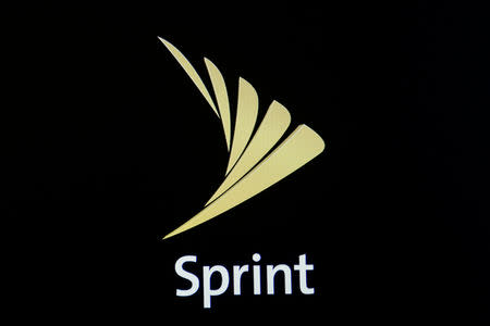 The Sprint logo is displayed on a a screen on the floor of the New York Stock Exchange (NYSE) in New York City, U.S., April 30, 2018. REUTERS/Brendan McDermid/Files