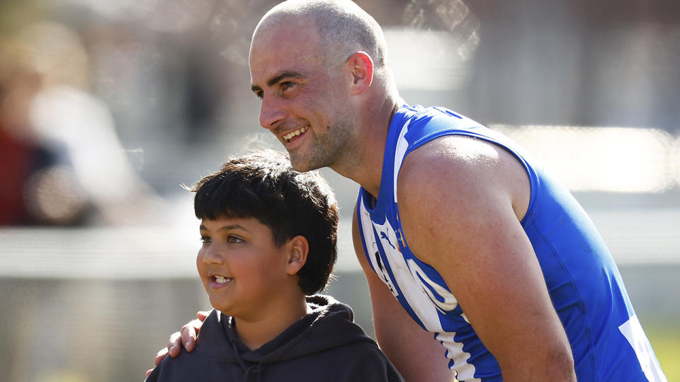 Ben Cunnington poses for a picture with a fan.