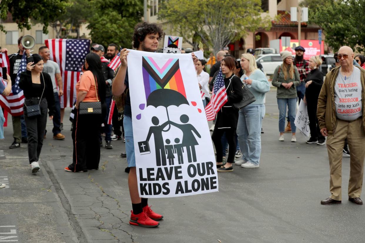 Protestors make their opinions known and join crowds that gathered outside a Glendale Unified School District meeting