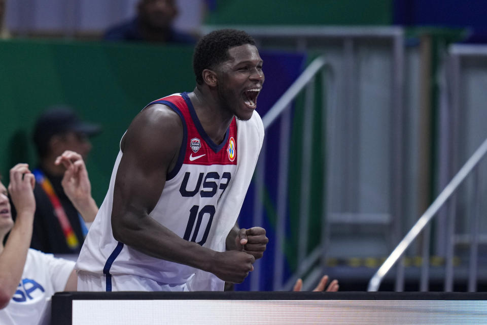 U.S. guard Anthony Edwards (10) cheers from the bench during the second half of a Basketball World Cup group C matchagainst New Zealand in Manila, Saturday, Aug. 26, 2023. (AP Photo/Michael Conroy)