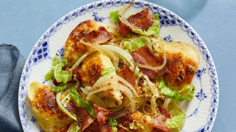 pierogi with sautéed cabbage and mustard seeds