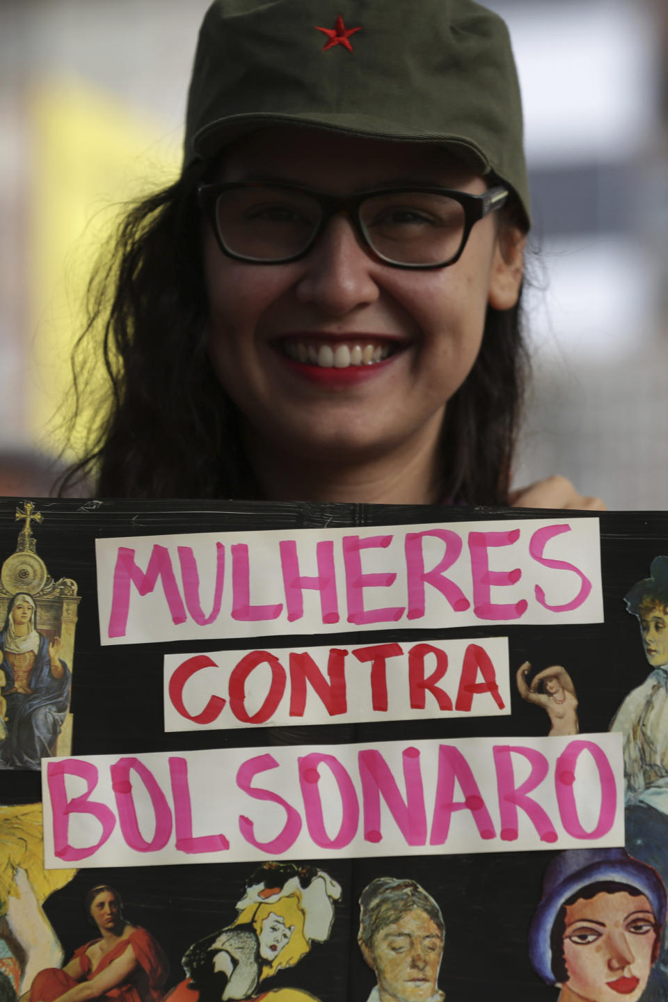 A woman shows a sign that reads in Portuguese "Women Against Bolsonaro" during a protest in Brasilia, Brazil, on Saturday, Oct. 20, 2018. Women and left-wing militants held protests across the country against the right-wing presidential candidate Jair Bolsonaro. (AP Photo/Eraldo Peres)