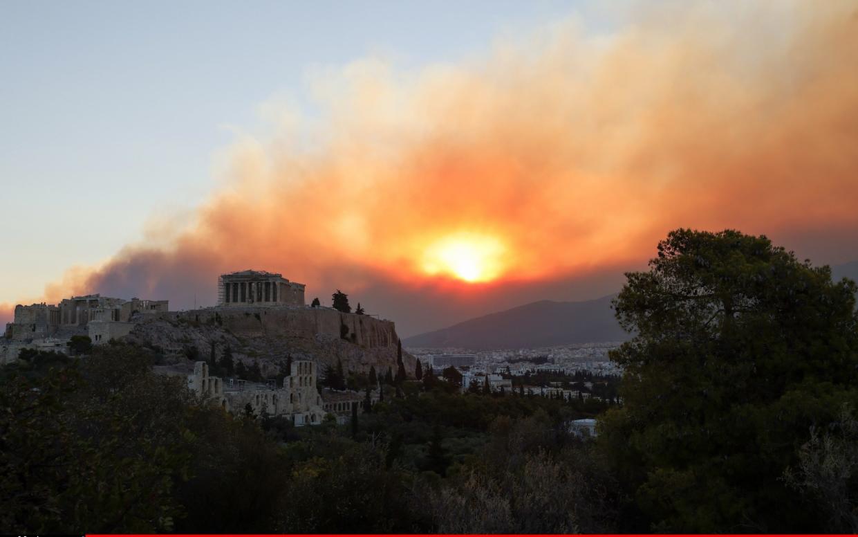 Smoke rises over the Parthenon in Athens