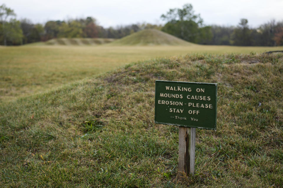 A sign reads "Walking on Mounds Causes Erosion - Please Stay Off -- Thank You," at the entrance of the Mound City Group at Hopewell Culture National Historical Park in Chillicothe, Ohio, Saturday, Oct. 14, 2023, before the Hopewell Ceremonial Earthworks UNESCO World Heritage Inscription Commemoration ceremony. A network of ancient American Indian ceremonial and burial mounds in Ohio noted for their good condition, distinct style and cultural significance, including Hopewell Culture National Historical Park, was added to the list of UNESCO World Heritage sites. (AP Photo/Carolyn Kaster)