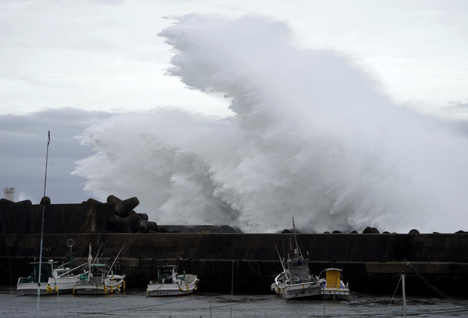 Surging waves hit against the breakwater while Typhoon Hagibis approaches at a port in town of Kiho, Mie prefecture, Japan Friday, Oct. 11, 2019. A powerful typhoon is advancing toward the Tokyo area, where torrential rains are expected this weekend. (AP Photo/Toru Hanai)