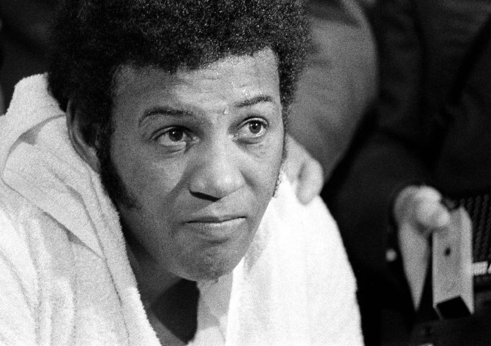 FILE - In this Feb. 16, 1970, file photo, a defeated Jimmy Ellis as shown in his dressing room after losing heavyweight title bout to Joe Frazier at New York's Madison Square Garden. Ellis, a former heavyweight boxing champion who trained with fellow Louisville fighter Muhammad Ali and squared off against some of his era's best fighters, has died in his hometown Tuesday, May 6, 2014. He was 74. Ellis' brother, Jerry, said the ex-champion died at a Louisville hospital Tuesday after suffering from Alzheimer's disease in recent years. (AP Photo/File)