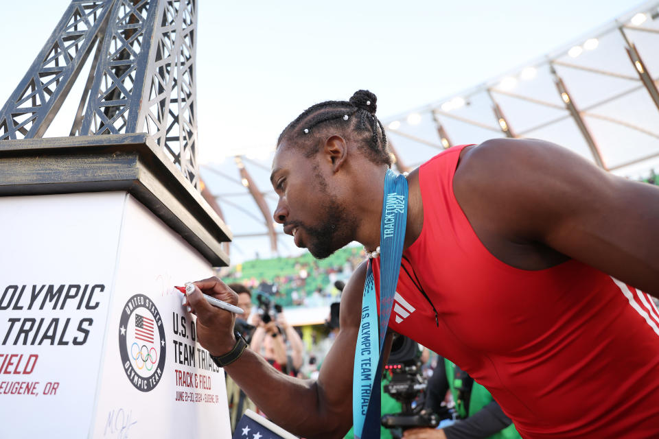 EUGENE, OREGON - JUNE 23: Noah Lyles signs a miniature Eiffel Tower after winning the men's 100 meter final on Day Three 2024 U.S. Olympic Team Trials Track & Field at Hayward Field on June 23, 2024 in Eugene, Oregon. (Photo by Christian Petersen/Getty Images)