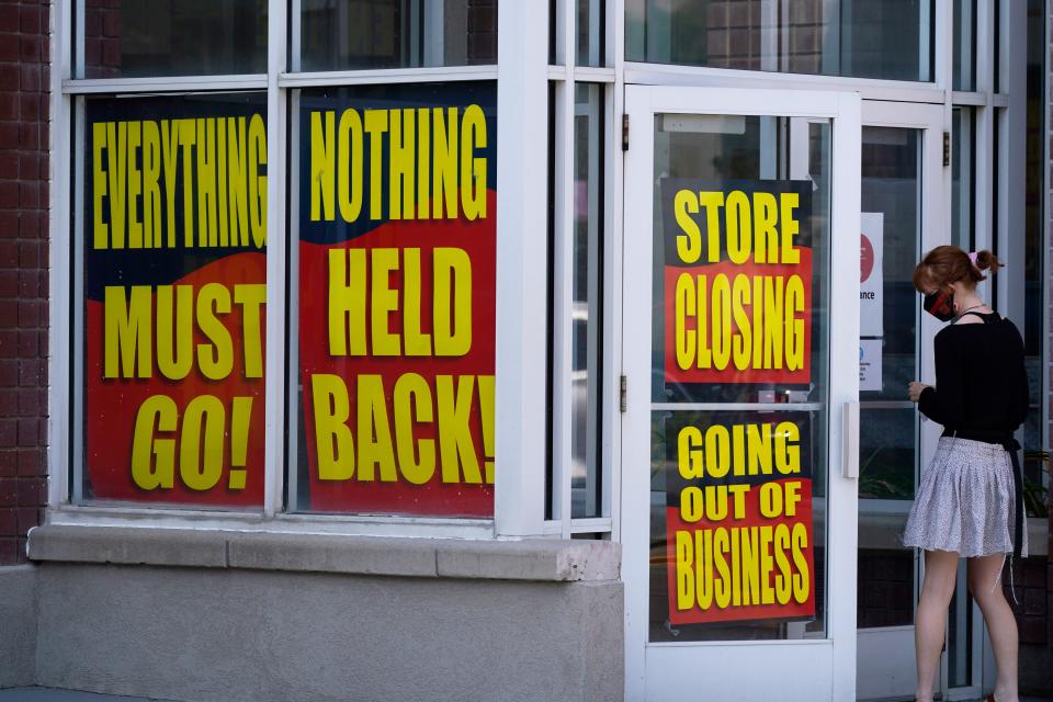 Sale signs adorn a closing Stein Mart store in Salt Lake City in August.