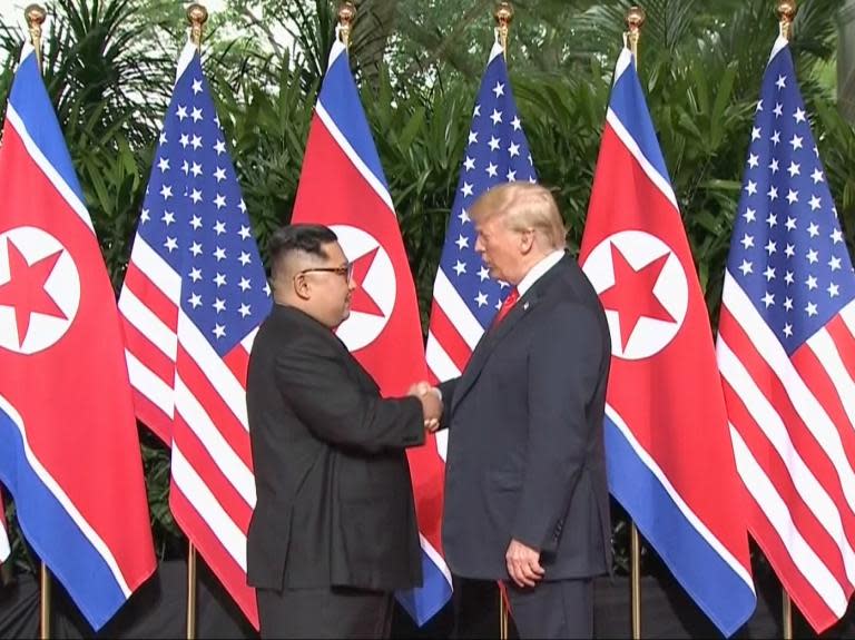 Trump and Kim Jong-un handshake begins historic US-North Korea summit