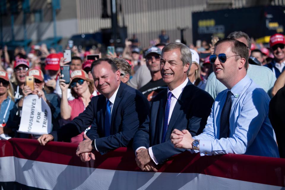 Senator Mike Lee (R-UT), Nigel Farage, and others wait for US President Donald Trump to speak during a Make America Great Again rally at Phoenix Goodyear Airport October 28, 2020, in Goodyear, Arizona. (Photo by Brendan Smialowski / AFP) (Photo by BRENDAN SMIALOWSKI/AFP via Getty Images)