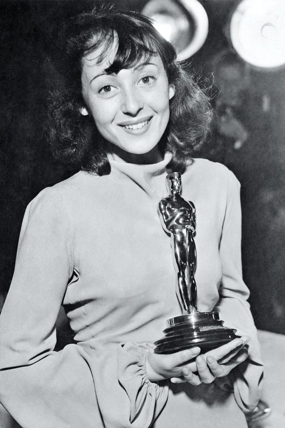 Luise Rainer holds the 1937 Academy Award she received for her performance in The Good Earth.