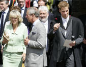 <p>Prince William waves as he leaves the St Salvator's Quadrangle with the Duke and Duchess of Rothesay, as they are known in Scotland, beside him. (PA Images)</p> 