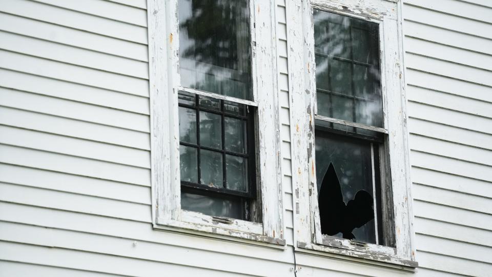 City of Columbus code enforcement officer Matthew Mercer believes in the "broken window" theory of urban living: A house can remain unoccupied and look fine, but as soon as one window breaks and rain gets in the house, the whole building begins to decay. He cited this theory while outside this house at 794 Renick St. on the West Side.