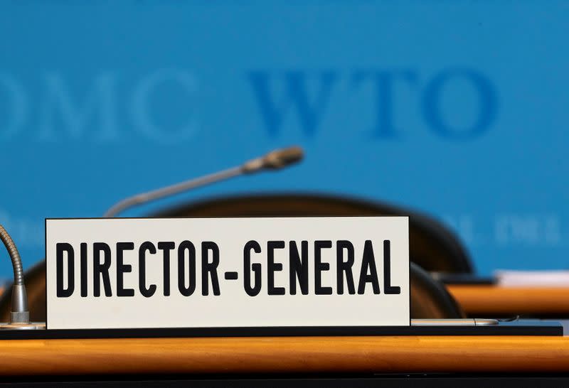 A sign is pictured in front of the chair of the Director General before the start of the General Council of the World Trade Organization (WTO) in Geneva