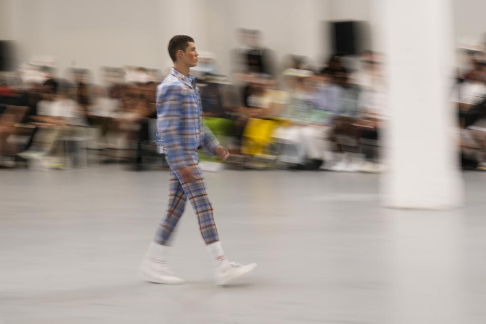 A model wears a creation as part of the Jeffrey Loverboy men's Spring Summer 2024 collection presented in Milan, Italy, Sunday, June 18, 2023. (AP Photo/Antonio Calanni)