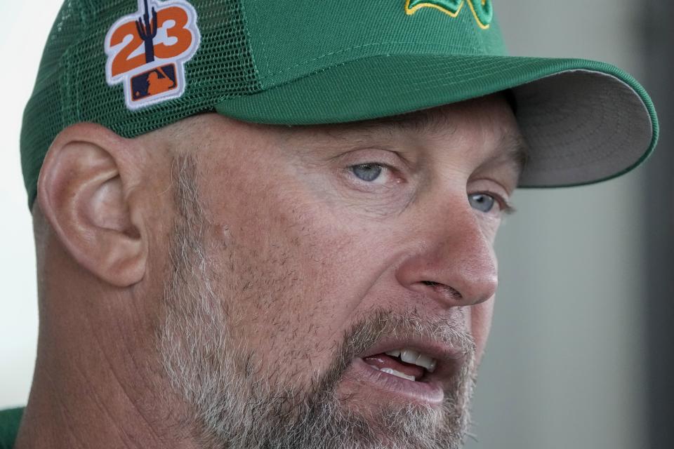 Oakland Athletics manager Mark Kotsay answers questions during a spring training baseball workout Monday, Feb. 20, 2023, in Mesa, Ariz. (AP Photo/Morry Gash)