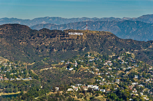 The Hollywood Sign (formerly known as the Hollywoodland Sign) is a landmark and American cultural icon located in Los Angeles, California. It is situated on Mount Lee in the Hollywood Hills area of the Santa Monica Mountains. The sign overlooks the Hollywood district of Los Angeles.