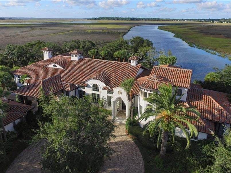 Spanish style house surrounded by trees on a private island in Georgia