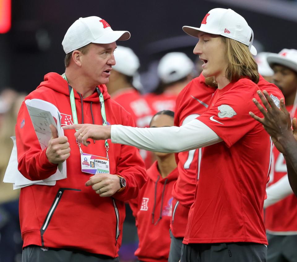 AFC head coach Peyton Manning (L) talks with quarterback Trevor Lawrence of the Jacksonville Jaguars and AFC during the 2023 NFL Pro Bowl Games at Allegiant Stadium on February 05, 2023 in Las Vegas, Nevada.