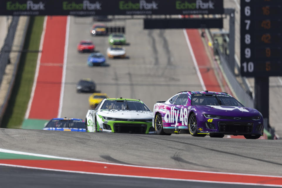 Alex Bowman (48) steers out of Turn 1 during a NASCAR Cup Series auto race at Circuit of the Americas, Sunday, March 26, 2023, in Austin, Texas. (AP Photo/Stephen Spillman)