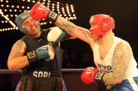 <p>Robert Marzano (red) hits Jafet Sori (blue) with a solid right in the TD1 ATU Grudge Match at the NYPD Boxing Championships at the Hulu Theater at Madison Square Garden on March 15, 2018. (Gordon Donovan/Yahoo News) </p>