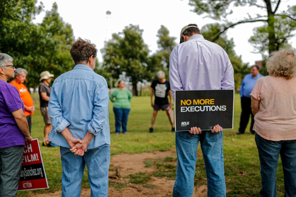 Anti-death penalty activists gather Thursday at the Governor’s Mansion ahead of the execution of Anthony Sanchez.