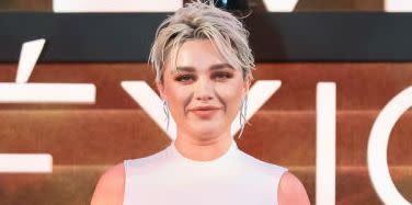 florence pugh goes braless in a white dress at the dune part two red carpet