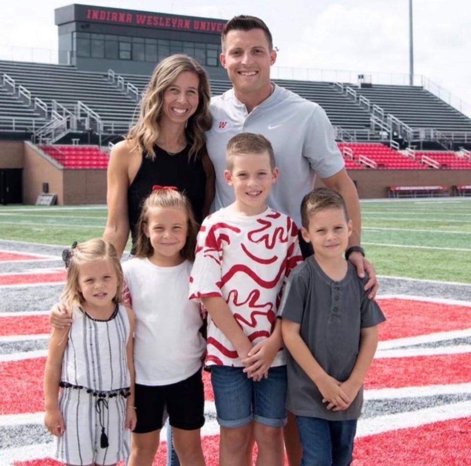 Climax-Scotts graduate Jordan Langs, here with his wife and family, has been named as an assistant coach for the Iowa State University football team.