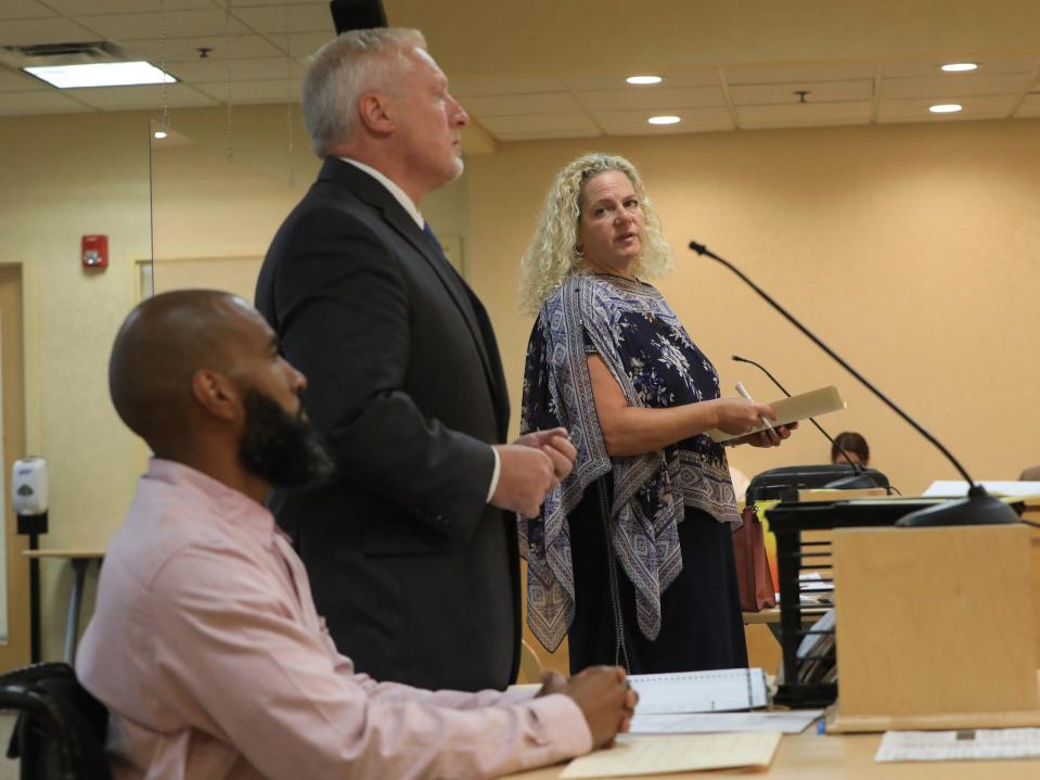 Special District Attorney Julia Cornachio speaks while in the Town of Wallkill in Middletown on August 23, 2023. Edward Holley and his attorney Paul Weber are in the foreground. 