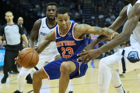 Nov 25, 2018; Memphis, TN, USA; New York Knicks guard Trey Burke (23) maintains his dribble as Memphis Grizzlies guard Shelvin Mack (6) looks on at FedExForum. Knicks won 103-98. Mandatory Credit: Nelson Chenault-USA TODAY Sports