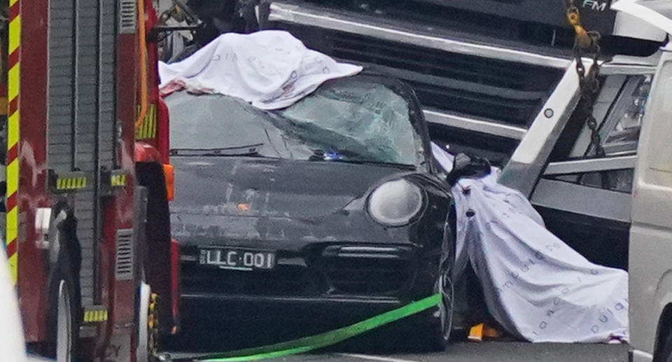 A truck ploughed into this Porsche and the four police officers standing outside their cars in the emergency lane. Source: AAP